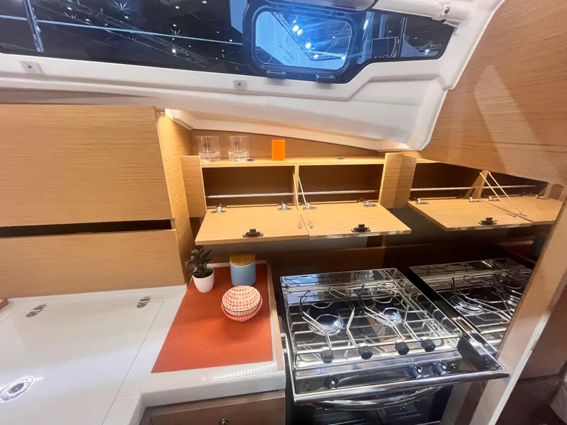 Slide: The Image of Modern kitchen in 2026 Jeanneau Sun Odyssey 350 yacht with stove and storage. - 19