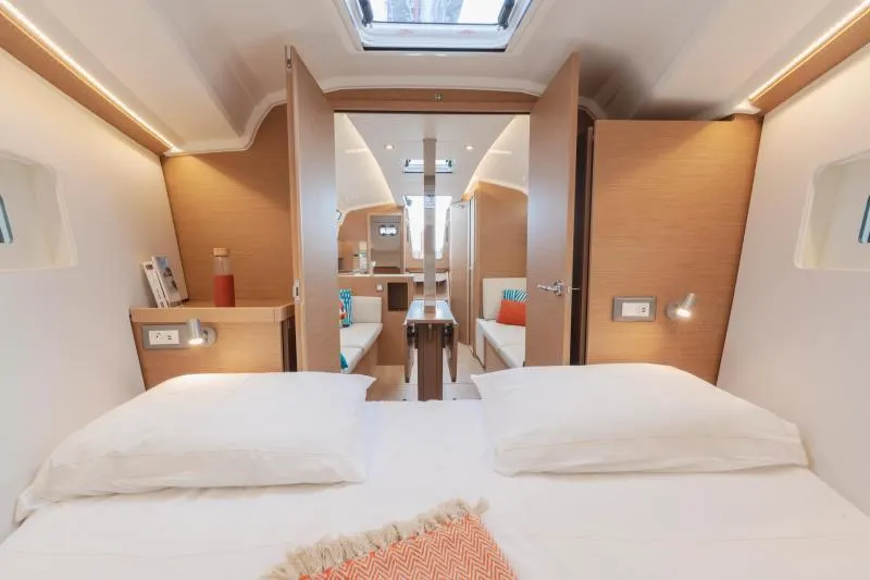 Slide: The Image of Luxurious interior of 2026 Jeanneau Sun Odyssey 350 yacht, featuring cozy bedroom and modern design. - 24
