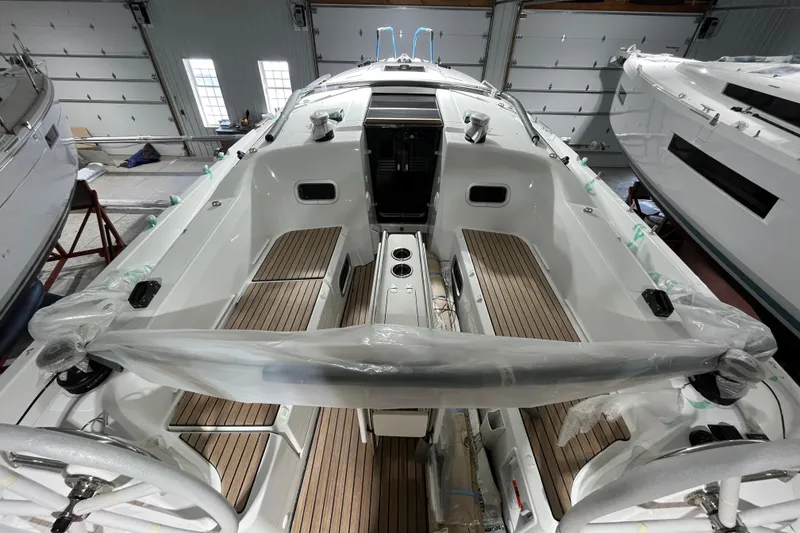 Slide: The Image of 2026 Jeanneau Sun Odyssey 350 sailboat interior with sleek design and wooden flooring. - 3