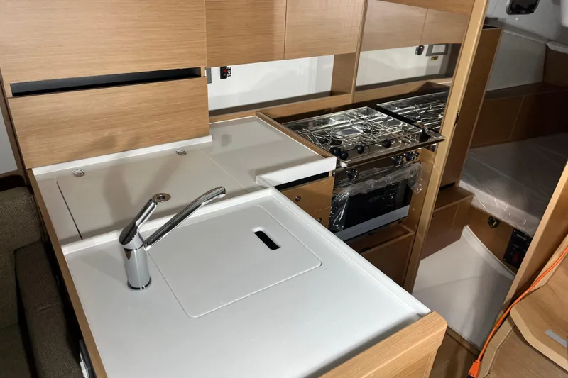 Slide: The Image of Modern kitchen in 2026 Jeanneau Sun Odyssey 350 yacht with sleek design and appliances. - 4