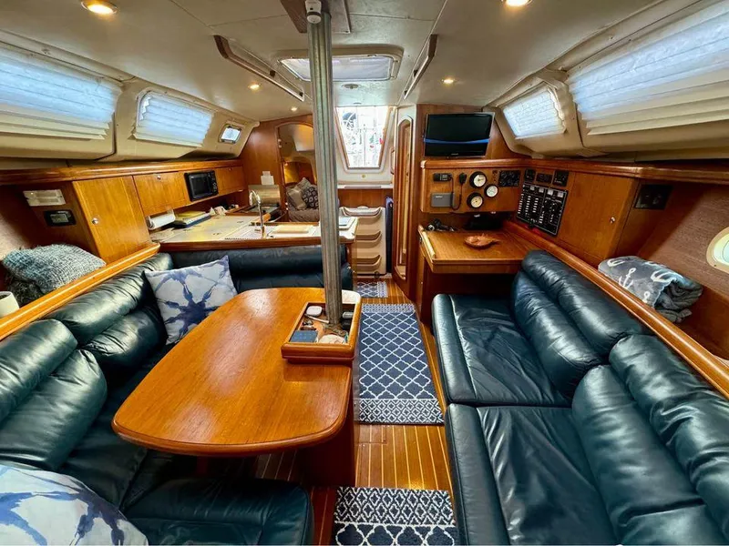 Slide: The Image of Luxurious 2002 Hunter 356 yacht interior with wood finish and leather seating. - 16