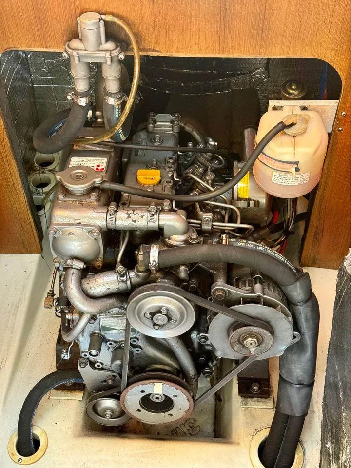 Slide: The Image of 2002 Hunter 356 engine compartment with visible components and hoses. - 19