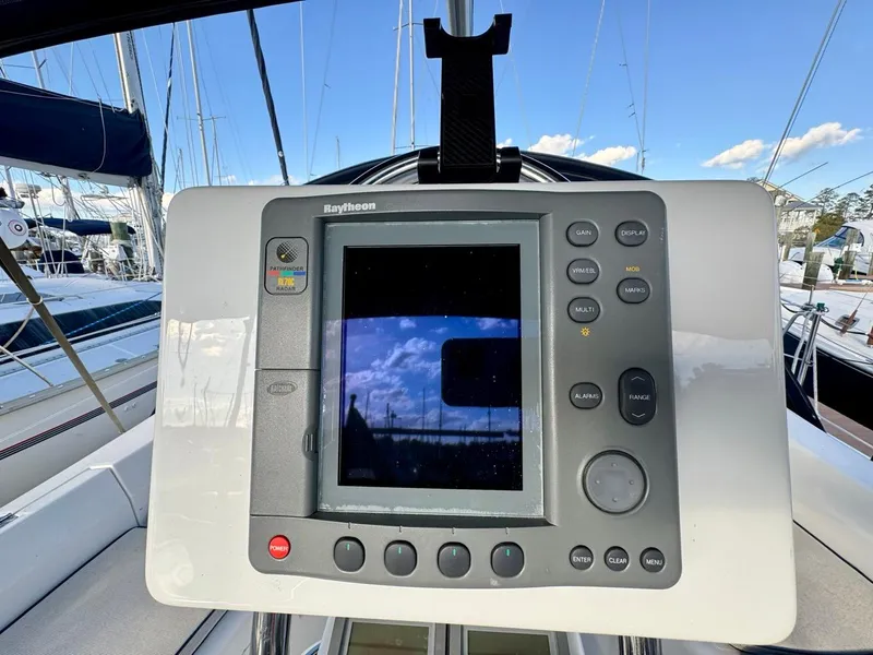 Slide: The Image of Raytheon marine navigation system on a 2002 Hunter 356 sailboat. - 23
