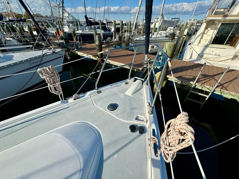 Slide: The Image of 2002 Hunter 356 sailboat docked at marina with clear sky. - 28