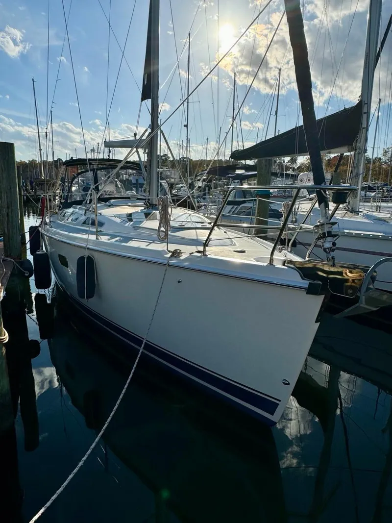 Slide: The Image of Sailboat docked in marina, 2002 Hunter 356 model, under sunny sky. - 41