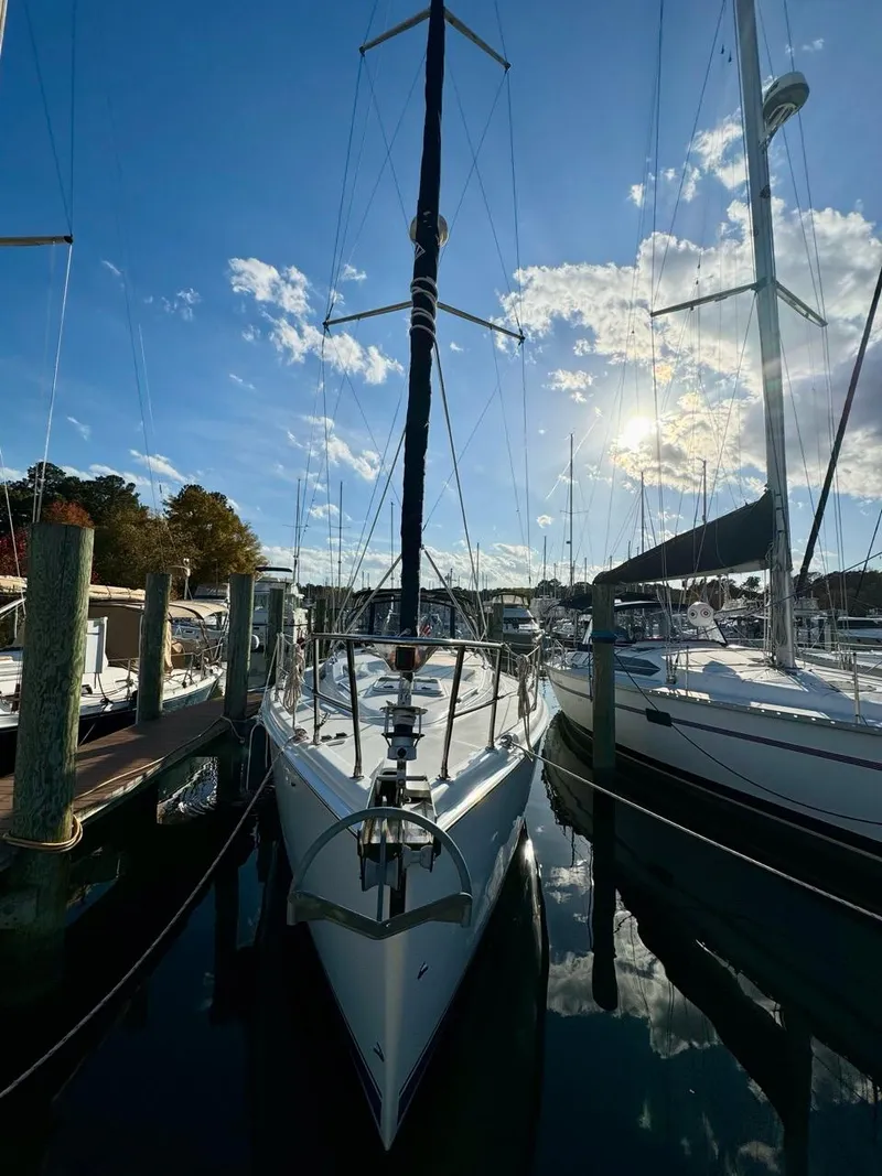 Slide: The Image of Sailboat docked at marina, Hunter 356 model, 2002, under a clear blue sky. - 42