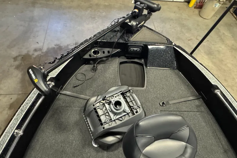 Slide: The Image of 2024 Nitro ZV20 boat interior with Minn Kota trolling motor and seating. - 16