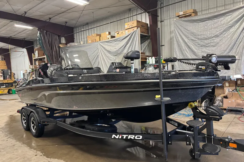 Slide: The Image of 2024 Nitro ZV20 boat in a warehouse, showcasing sleek design and advanced features. - 2