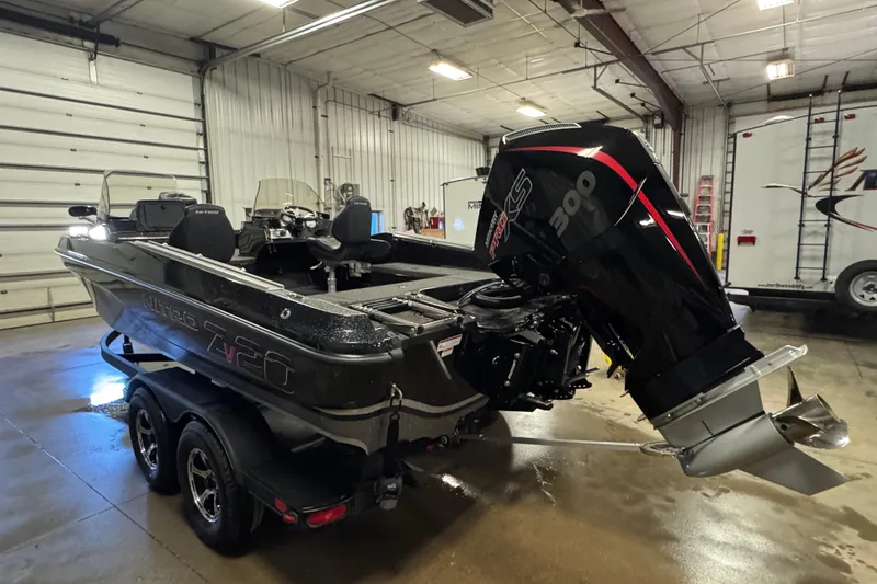 Slide: The Image of 2024 Nitro ZV20 boat with powerful engine in a spacious indoor garage. - 5