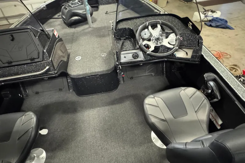 Slide: The Image of 2024 Nitro ZV20 boat interior with steering wheel and seating. - 7