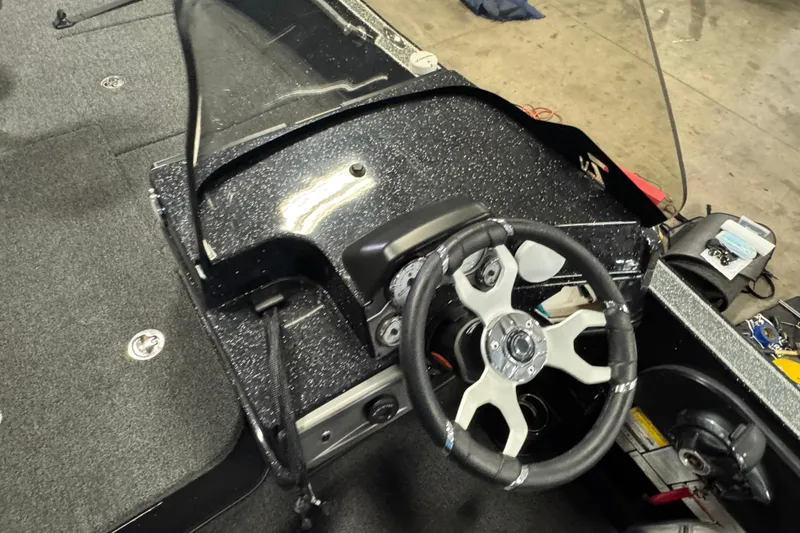 Slide: The Image of 2024 Nitro ZV20 boat cockpit with steering wheel and dashboard controls. - 9