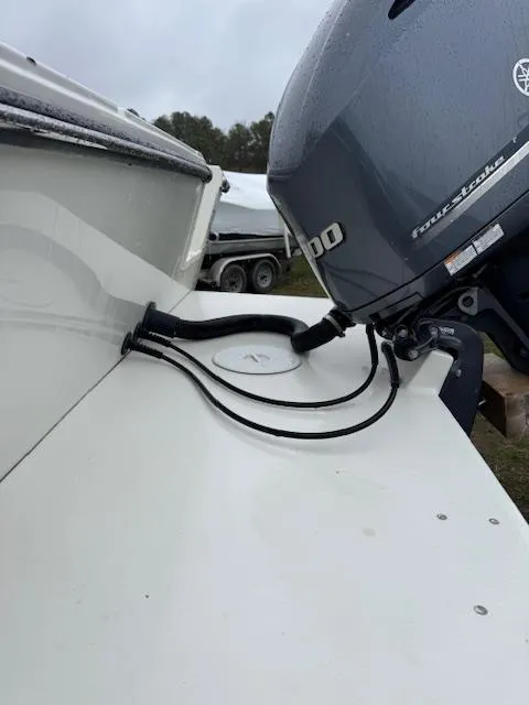 Slide: The Image of 2015 Parker 2510 XLD boat with Yamaha outboard motor, docked outdoors. - 8