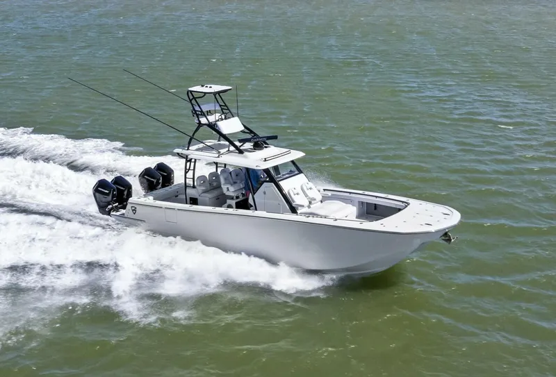 Slide: The Image of 2024 Barker Boatworks 40 High Performance Cat cruising on water. - 1