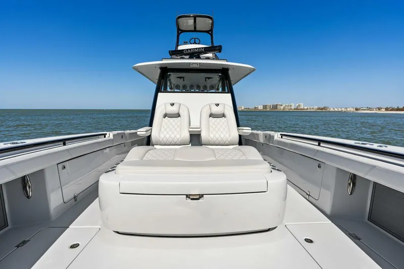 Slide: The Image of 2024 Barker Boatworks 40 High Performance Cat on open water, showcasing luxury seating and sleek design. - 10