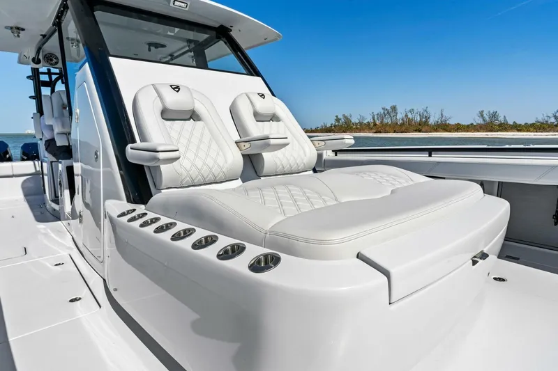 Slide: The Image of 2024 Barker Boatworks 40 High Performance Cat with luxurious seating and sleek design. - 11