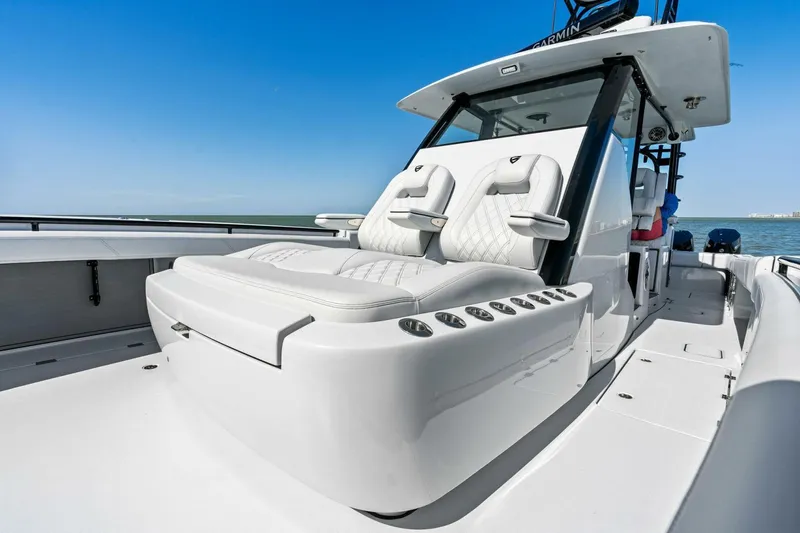 Slide: The Image of 2024 Barker Boatworks 40 High Performance Cat with luxurious seating and sleek design. - 12