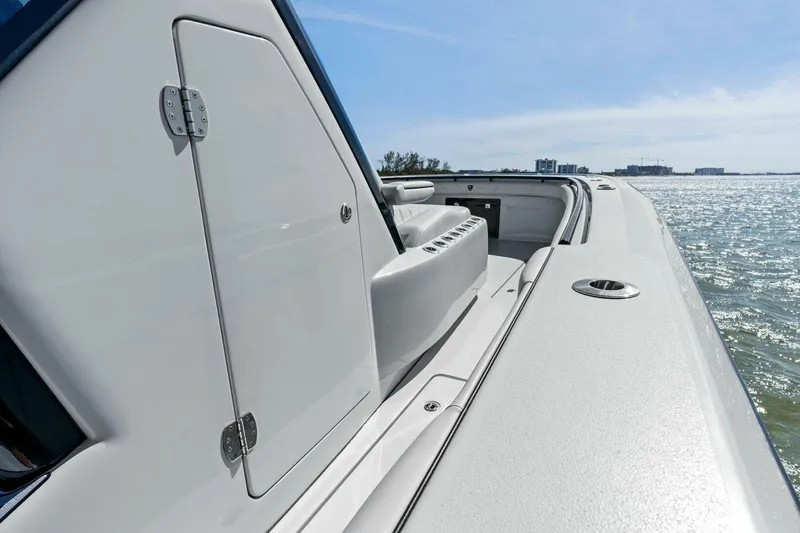 Slide: The Image of 2024 Barker Boatworks 40 High Performance Cat on water, showcasing sleek design and craftsmanship. - 14