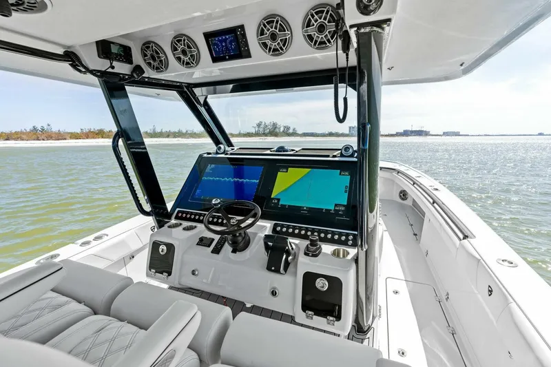 Slide: The Image of 2024 Barker Boatworks 40 High Performance Cat cockpit with advanced navigation displays. - 16
