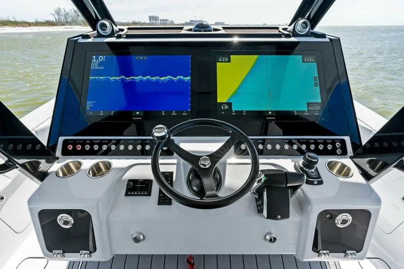 Slide: The Image of 2024 Barker Boatworks 40 High Performance Cat cockpit with dual navigation screens. - 17