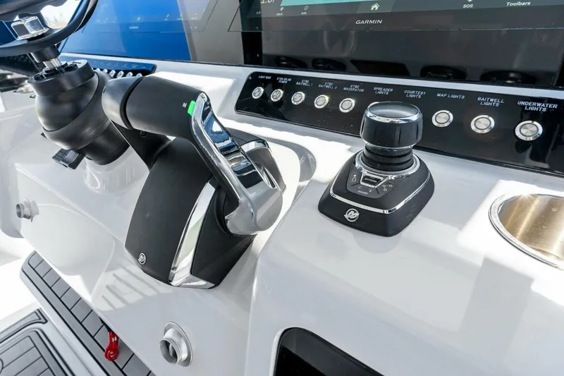 Slide: The Image of 2024 Barker Boatworks 40 High Performance Cat cockpit controls and navigation system. - 18