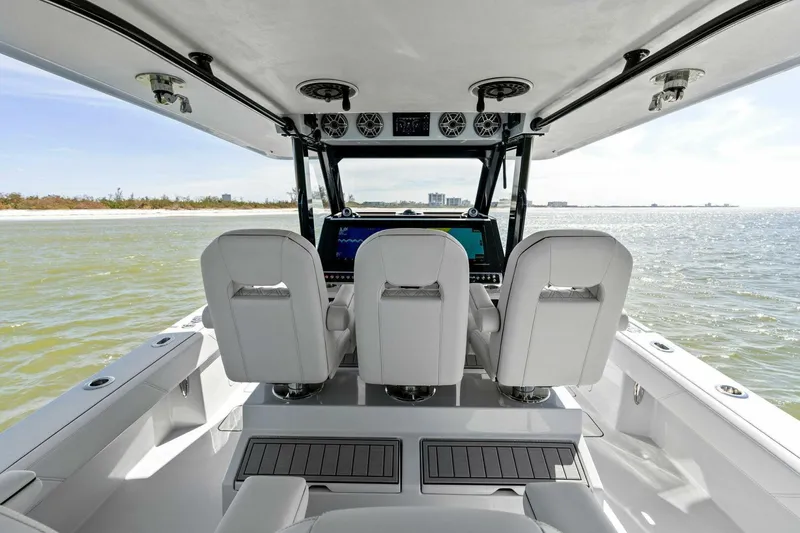 Slide: The Image of 2024 Barker Boatworks 40 High Performance Cat interior with sleek seating and modern controls. - 21