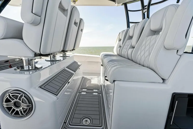 Slide: The Image of 2024 Barker Boatworks 40 High Performance Cat interior with luxurious seating and sleek design. - 26
