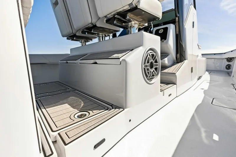 Slide: The Image of 2024 Barker Boatworks 40 High Performance Cat interior with seating and speaker detail. - 27