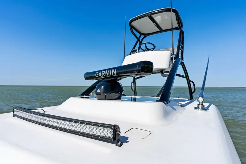 Slide: The Image of 2024 Barker Boatworks 40 High Performance Cat with Garmin equipment on open water. - 28