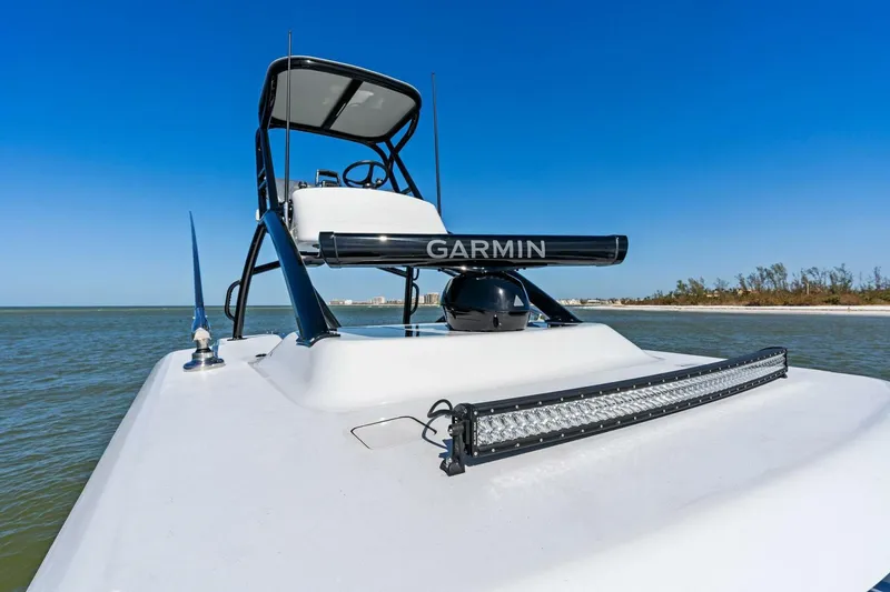Slide: The Image of 2024 Barker Boatworks 40 High Performance Cat on water, featuring Garmin equipment. - 29