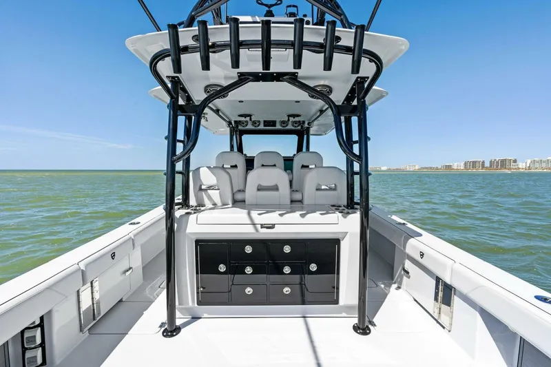 Slide: The Image of 2024 Barker Boatworks 40 High Performance Cat on open water, showcasing sleek design and seating. - 34