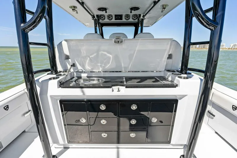 Slide: The Image of 2024 Barker Boatworks 40 High Performance Cat with sleek outdoor kitchen setup. - 37