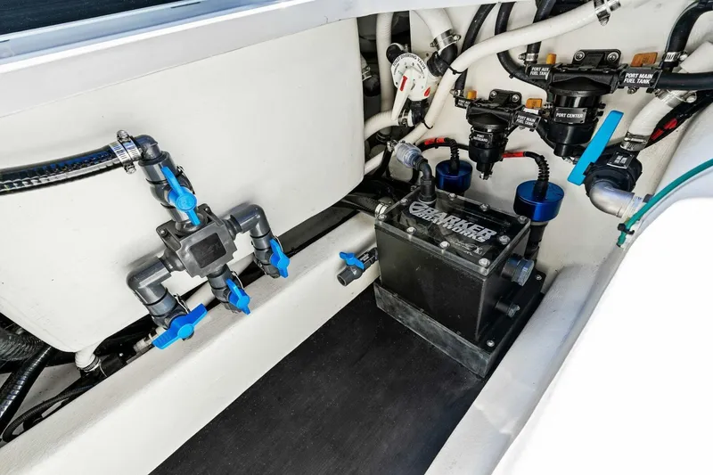 Slide: The Image of 2024 Barker Boatworks 40 High Performance Cat engine compartment with advanced plumbing and wiring systems. - 45