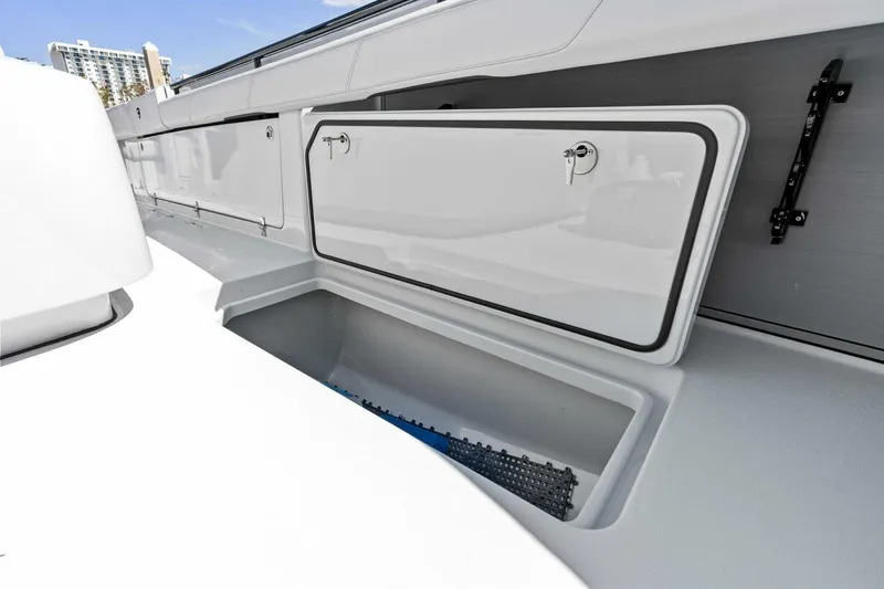 Slide: The Image of 2024 Barker Boatworks 40 High Performance Cat storage compartment detail. - 48