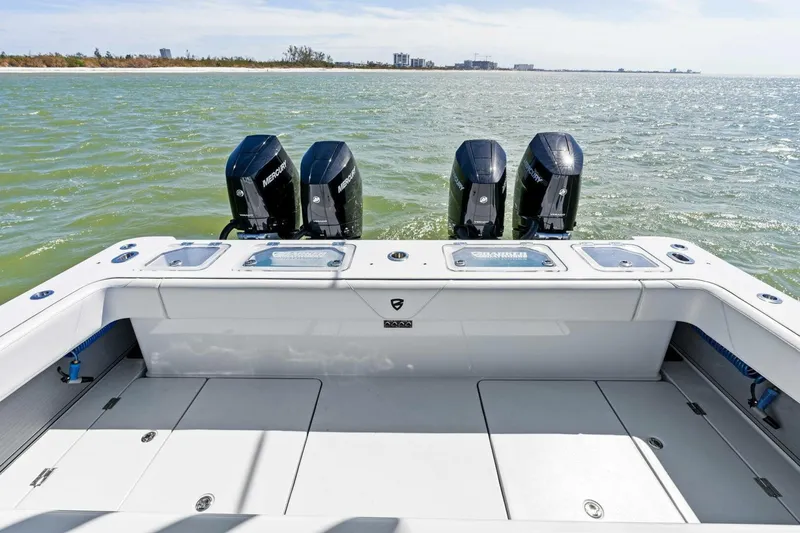Slide: The Image of 2024 Barker Boatworks 40 High Performance Cat with four powerful outboard engines. - 6