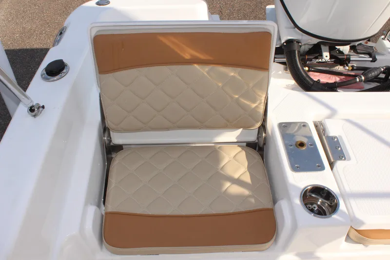 Slide: The Image of 2025 NauticStar 231 Hybrid boat seat with tan and beige upholstery. - 13