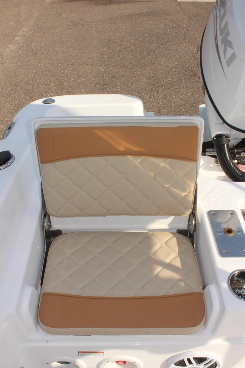 Slide: The Image of 2025 NauticStar 231 Hybrid boat seat with beige and tan upholstery. - 14