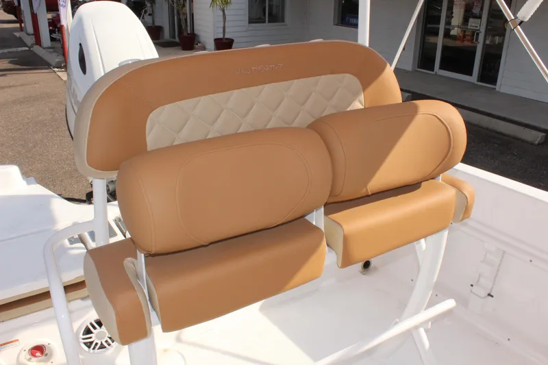 Slide: The Image of 2025 NauticStar 231 Hybrid boat seating with tan and cream upholstery. - 20