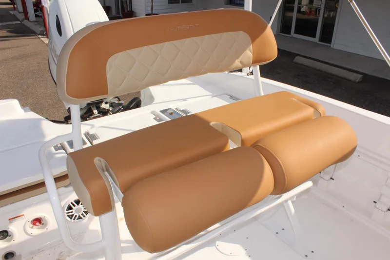 Slide: The Image of 2025 NauticStar 231 Hybrid boat seat with tan and cream upholstery. - 21