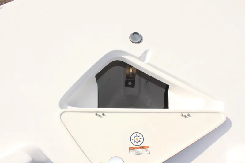 Slide: The Image of 2025 NauticStar 231 Hybrid boat storage compartment with open hatch. - 29