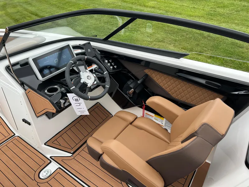 Slide: The Image of 2025 Yamaha Boats 252S cockpit with modern dashboard and luxurious seating. - 14