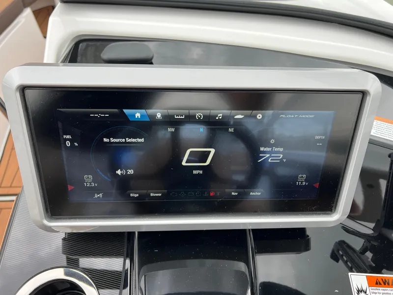 Slide: The Image of Dashboard display of 2025 Yamaha Boats 252S showing speed and water temperature. - 15