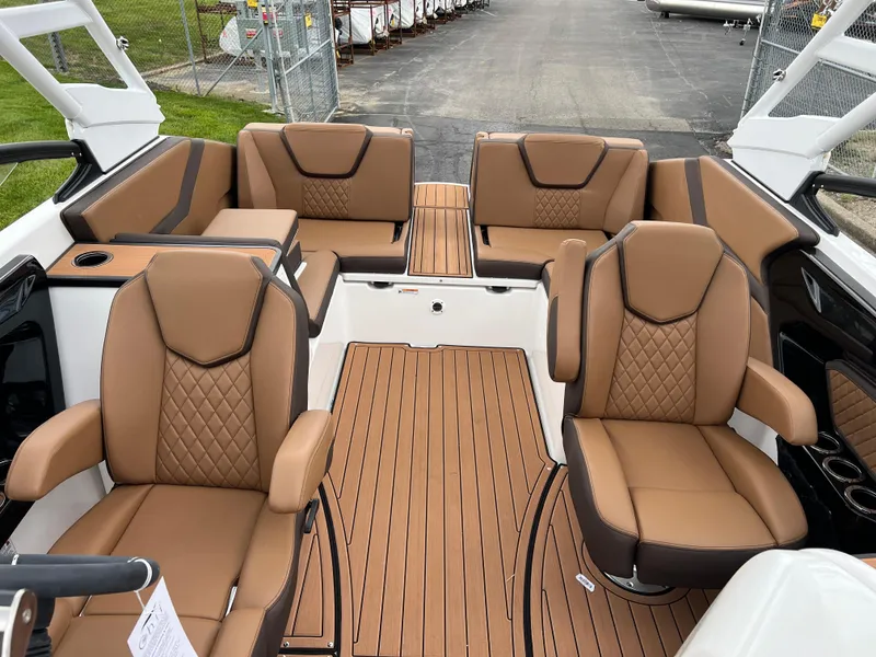 Slide: The Image of 2025 Yamaha Boats 252S interior with luxurious brown seating and sleek design. - 20
