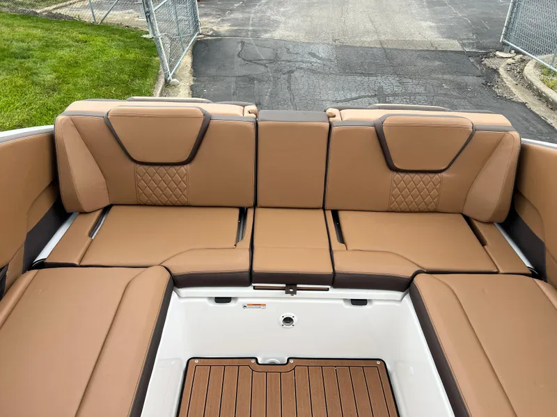 Slide: The Image of 2025 Yamaha Boats 252S interior with tan seating and modern design. - 22