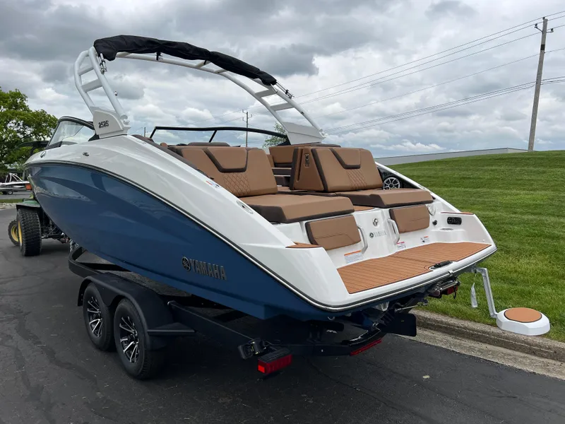 Slide: The Image of 2025 Yamaha Boats 252S on trailer, featuring sleek design and comfortable seating. - 6