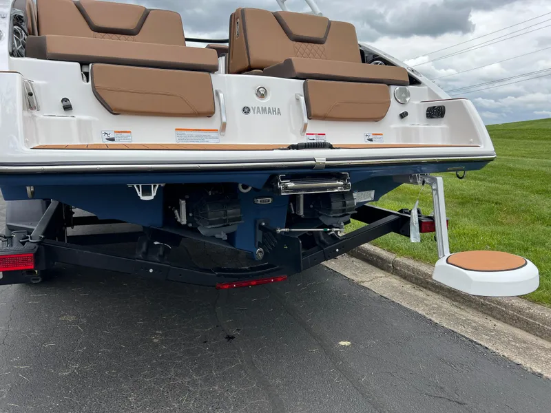 Slide: The Image of 2025 Yamaha Boats 252S rear view, showcasing dual engines and swim platform. - 7