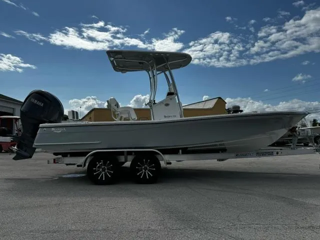 Slide: The Image of 2025 BlackJack 224 boat on trailer under blue sky with clouds. - 5