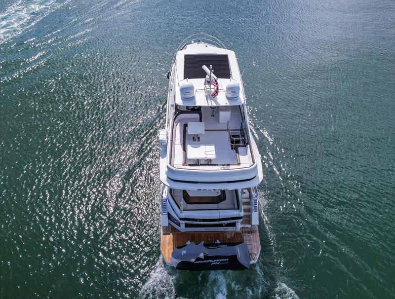 Slide: The Image of Aerial view of 2020 Galeon 640 Fly yacht cruising on open water. - 6