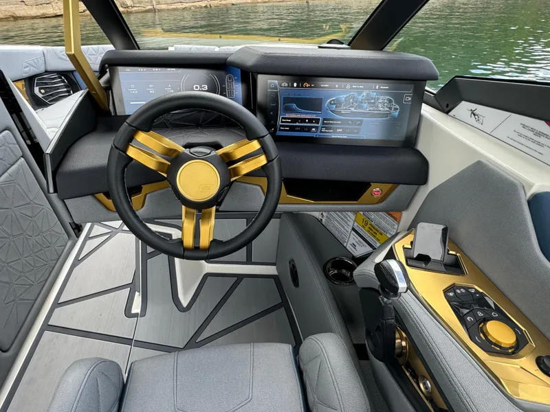 Slide: The Image of 2024 Nautique Super Air Nautique G25 Paragon cockpit with modern dashboard and luxurious interior. - 14