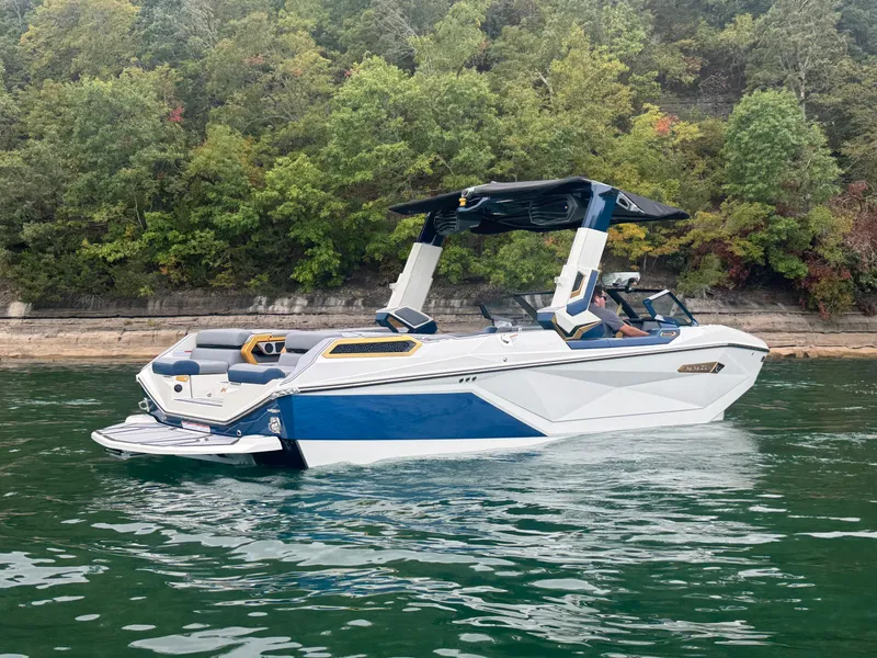 Slide: The Image of 2024 Nautique Super Air Nautique G25 Paragon on a serene lake. - 5