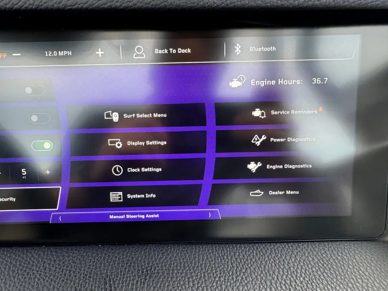 Slide: The Image of 2024 Nautique Super Air Nautique G25 Paragon dashboard display with various control options. - 6